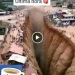 Enorme grieta en una zona urbana genera alarma: imagen muestra una profunda abertura en el terreno rodeada de viviendas y personas